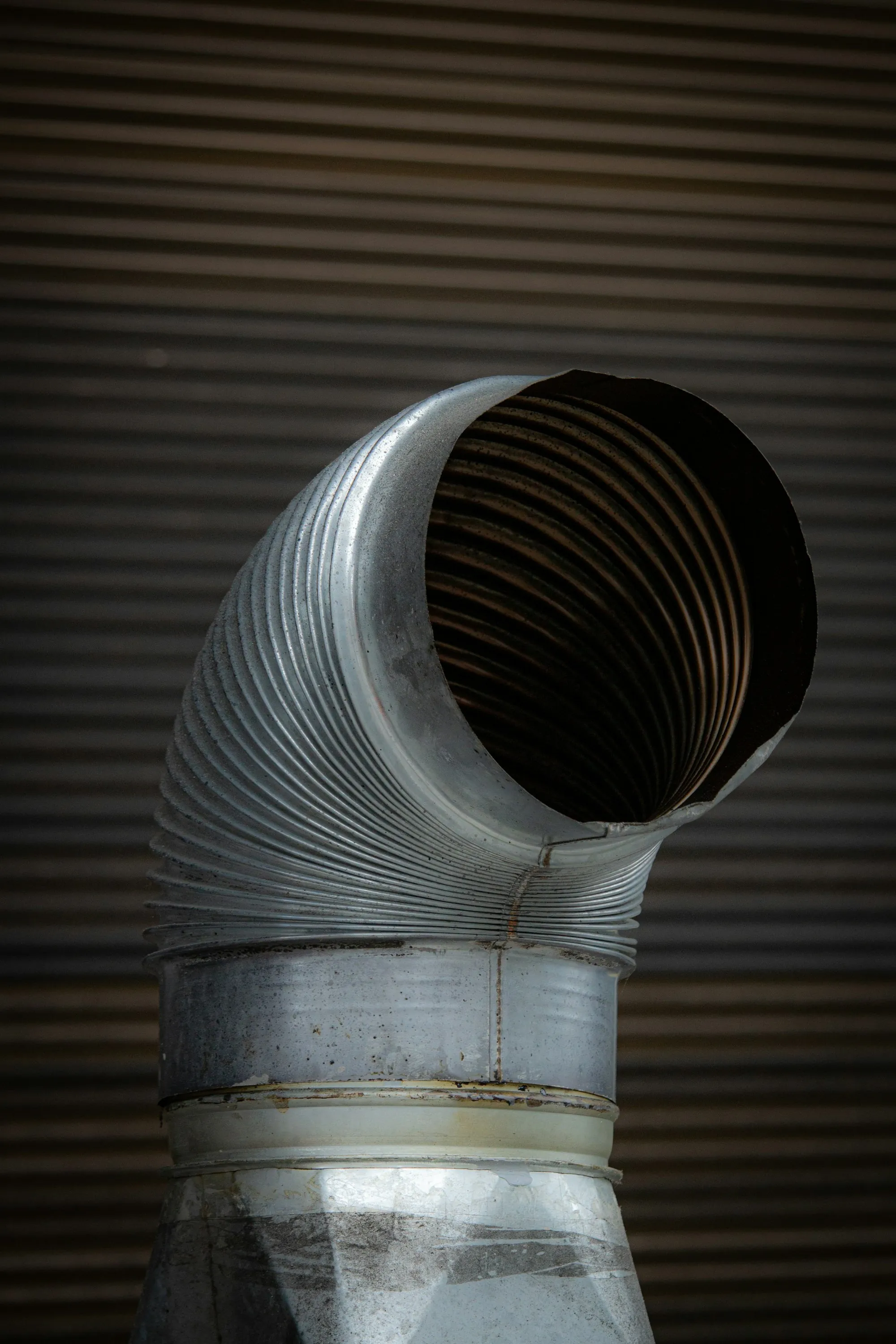 Close view of a flexible aluminum duct opening
